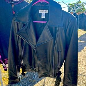 Black leather biker style jacket with belt. Like new! This style never gets old!